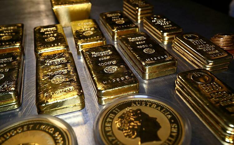 Vàng thỏi và xu vàng tại một kho chứa ở Munich (Đức). Ảnh: Reuters
