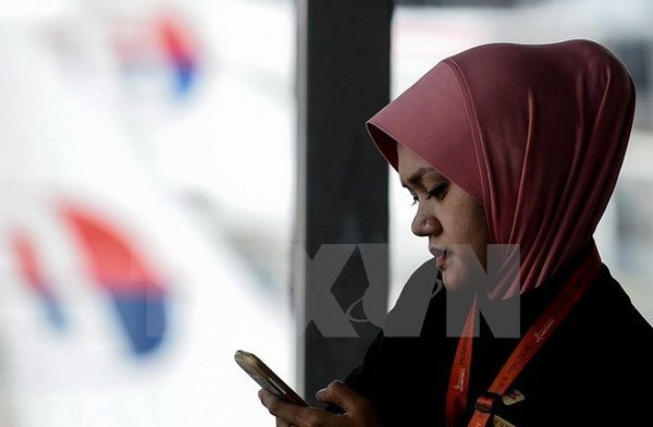 Hơn 46 triệu thuê bao di động ở Malaysia bị đánh cắp thông tin cá nhân. Ảnh: AFP/TTXVN.