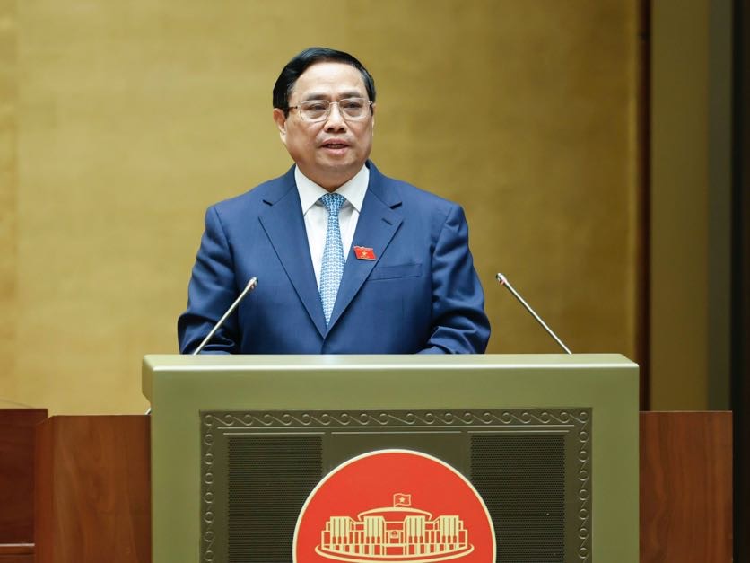 Thủ tướng Phạm Minh Chính trình bày Báo cáo giải trình, làm rõ thêm một số vấn đề được các vị đại biểu Quốc hội, đồng bào, cử tri quan tâm và trả lời chất vấn của đại biểu Quốc hội - Ảnh: VGP/Nhật Bắc