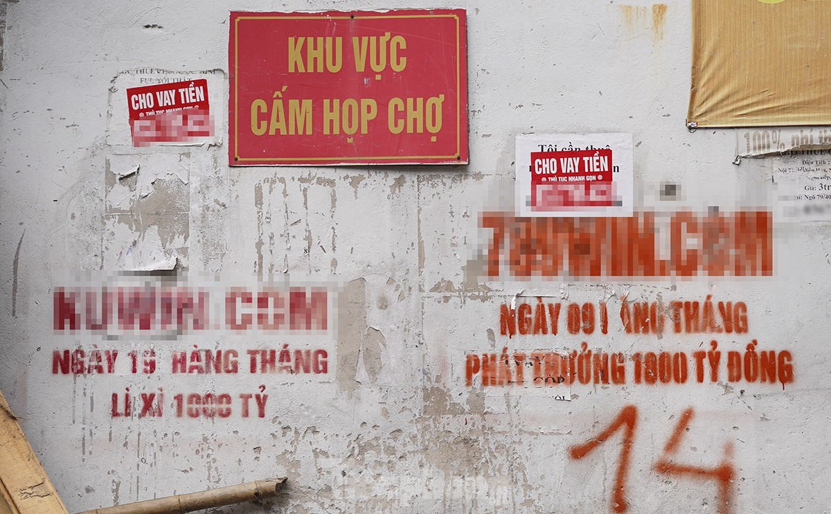 Online betting and gambling advertisements appear everywhere in Hanoi photo 12