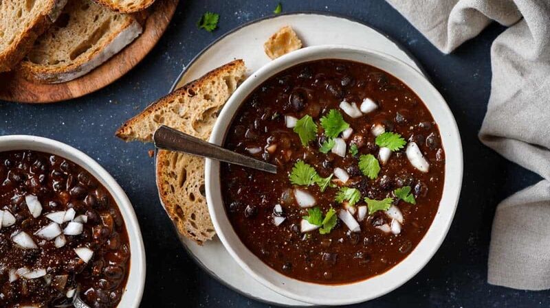 smoky-black-bean-soup-in-2-bowls-with-bread.jpg